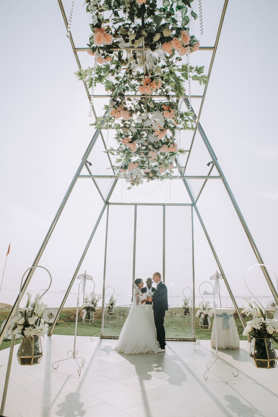 Coastal pavilion celebration with light, water and floral styling